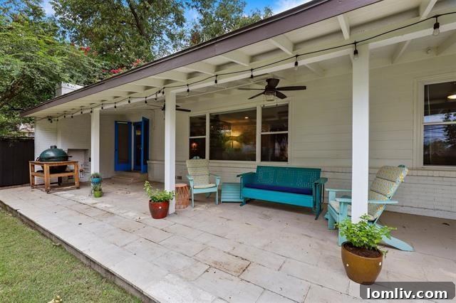 The serene and private backyard featuring a well-maintained grassy lawn and fencing.