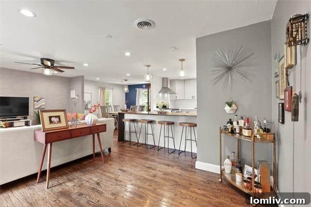 A sun-drenched living area with floor-to-ceiling windows offering picturesque treetop views.