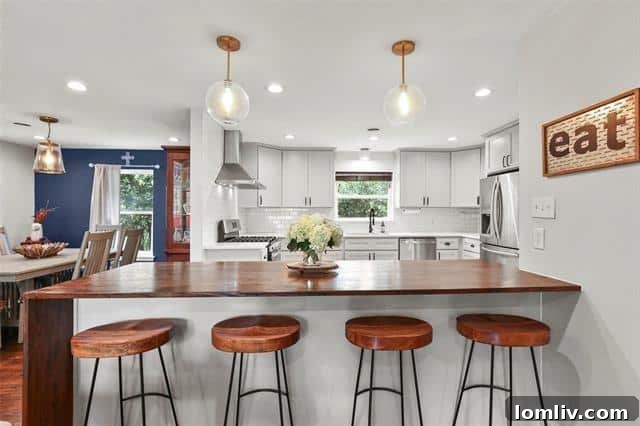 A modern kitchen with subway tile backsplash, integrating seamlessly into an open living space.