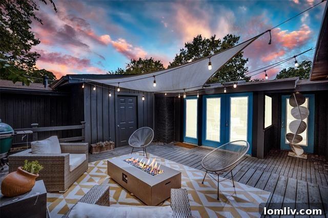 The stylish facade of a Cliff May designed Midcentury Modern home with expansive windows.