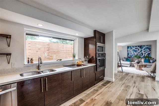 Bright and airy living space with characteristic Cliff May windows connecting to the outdoors.