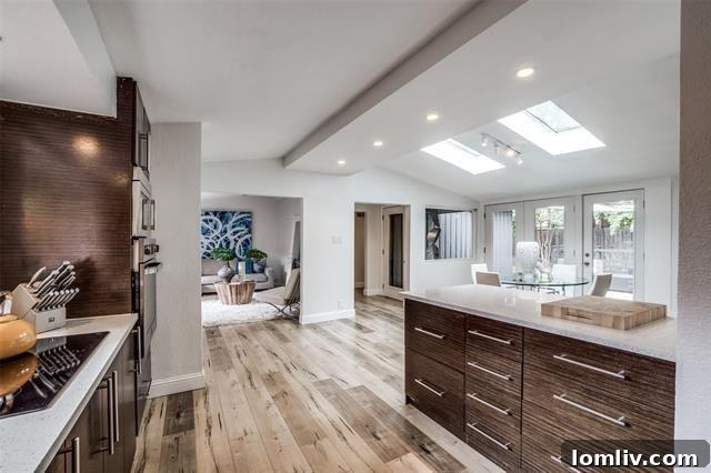 A cozy bedroom featuring ample natural light and Midcentury Modern design elements.