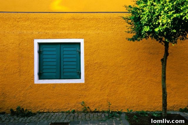 A wide-angle, striking black and white shot of the Leaning Tower of Pisa, emphasizing its tilt against a dramatic sky.