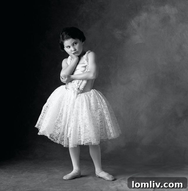 A textural close-up of a mesquite tree's bark and small green leaves, showcasing natural patterns and depth.