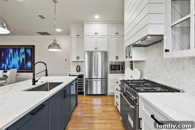 Gourmet kitchen featuring state-of-the-art appliances and marble backsplash
