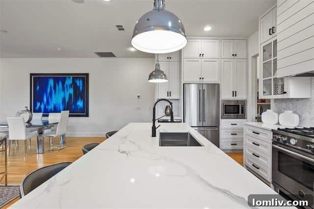 Elegant dining area adjacent to a modern, open kitchen