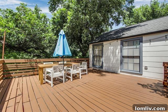 Open-plan dining area leading to outdoor deck