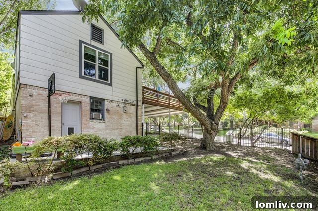 Lush backyard with basketball hoop, ideal for families