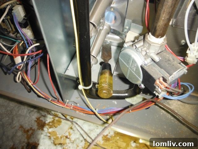 A forgotten screwdriver resting inside an electrical panel box, a dangerous foreign object.