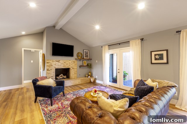 Four Corners Brewing Product Designer Showcases Farmers Branch Gem 5 Bright Living Room with Vaulted Ceilings and Modern Floors