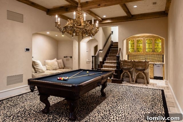 Spacious game room with billiards table and entertainment area, ideal for family fun.