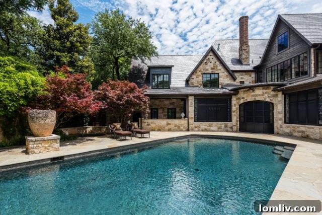 Sparkling swimming pool surrounded by a manicured landscape, offering relaxation and fitness.