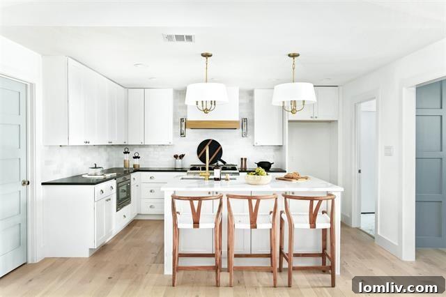 Stylish Kitchen Design with Mixed Metals and Contrasting Countertops