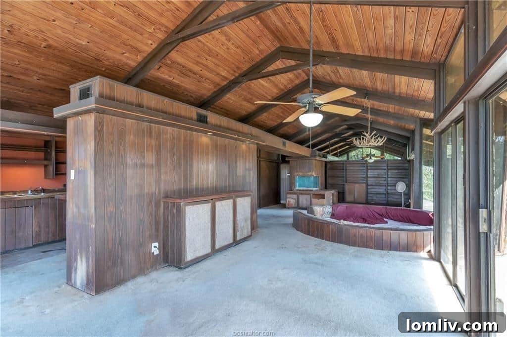 Conversation Pits The Second Chapter 11 Section of the conversation pit with a brick fireplace and heavily stained upholstery, requiring complete overhaul.