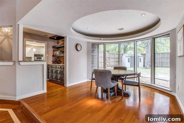 Far North Dallas Digs Where Every Angle Clicks 6 Circular dining area with a convenient butler's pantry bar in a Dallas home