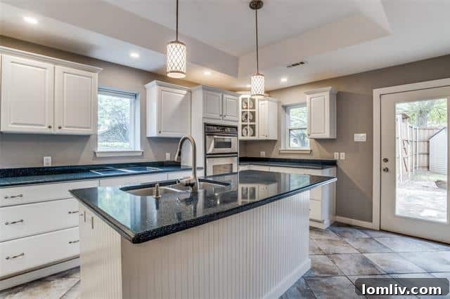 Far North Dallas Digs Where Every Angle Clicks 8 Modern and spacious kitchen in a Far North Dallas home, perfect for entertaining