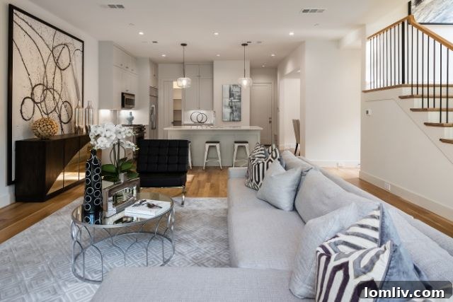 Sleek dining area seamlessly connected to the kitchen in a luxury duplex