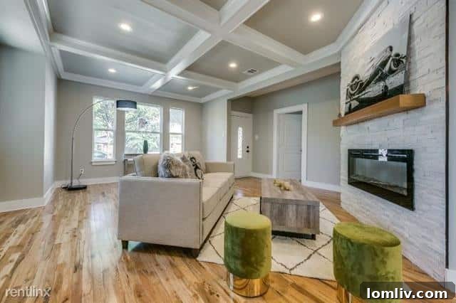 A bright and spacious living room in the North Oak Cliff charmer, featuring modern updates and a welcoming atmosphere.