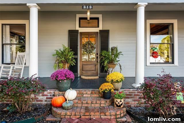 Exterior view of a beautifully renovated historic home in Kidd Springs Heights, Dallas, featuring classic architecture.