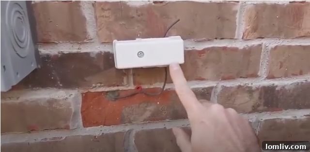 An installed electrical grounding device on a home's exterior that has not been properly connected, indicating a safety hazard.