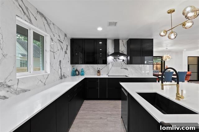 Luxurious marble kitchen with island and modern appliances