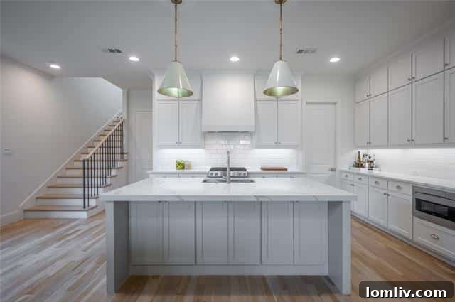 Stylish kitchen with marble-inspired counters and Kitchen-Aid appliances