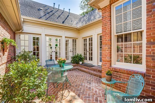 Bright and airy living space with bay windows and hardwood floors