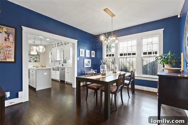 Stylish wet bar area with dark cabinetry, shelving, and a beverage cooler, perfect for entertaining