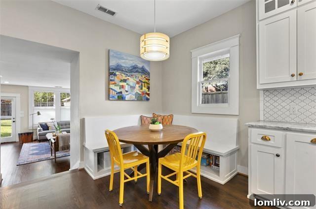 Cozy built-in breakfast nook with upholstered seating, offering a charming dining space