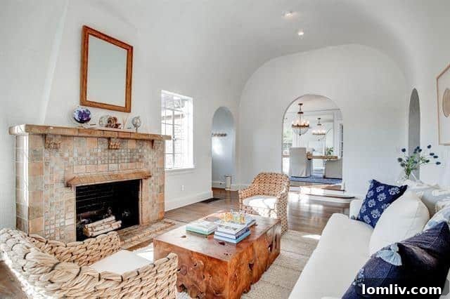 Berkley Place's Perfect Tudor: A Forest Park Masterpiece 4 Vaulted Living Room with Iconic Batchelder Tile Fireplace