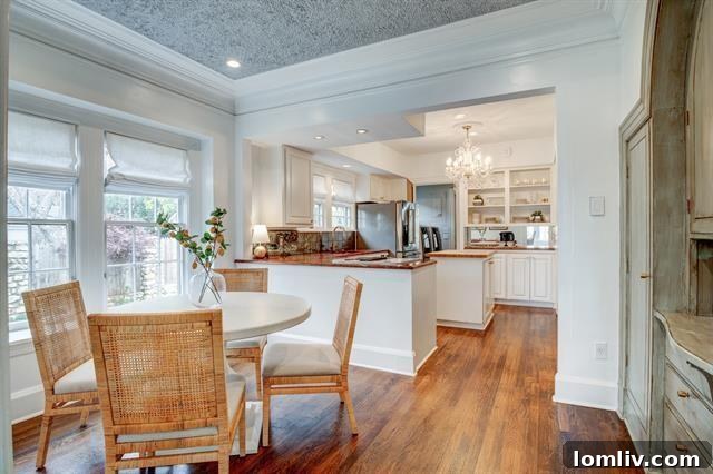 Berkley Place's Perfect Tudor: A Forest Park Masterpiece 7 Kitchen Island with Glamorous Chandelier and Ample Counter Space