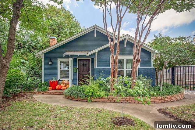 Quaint blue cottage with lush lawn and curb appeal in Arlington Heights Fort Worth