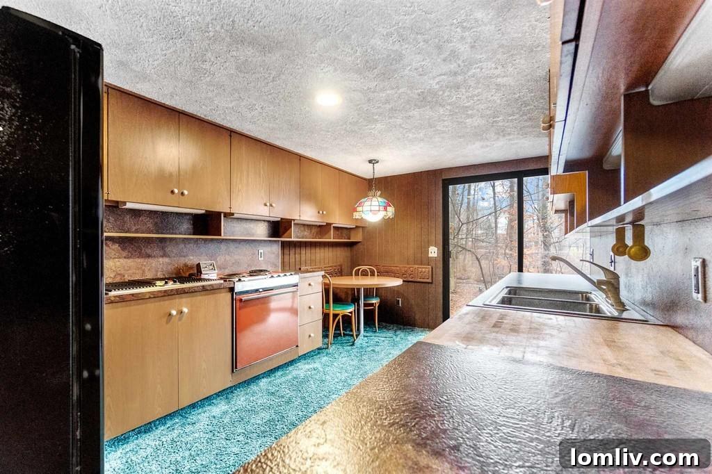 Unique curved staircase covered in purple carpet