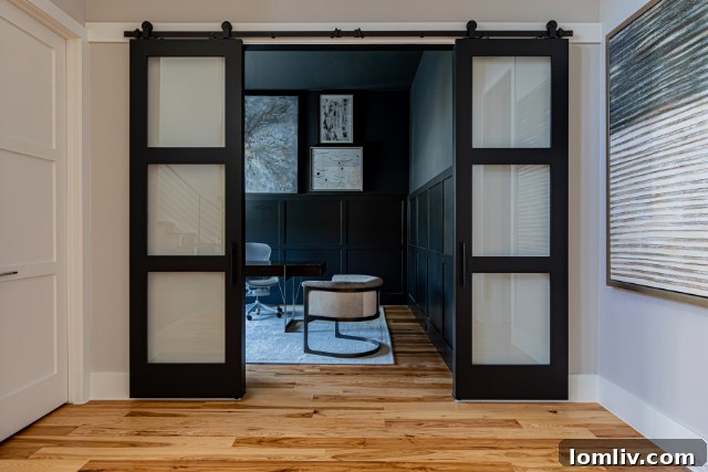 Ergonomic desk chair at a sleek white desk with a computer monitor and keyboard, highlighting essential ergonomic home office furniture