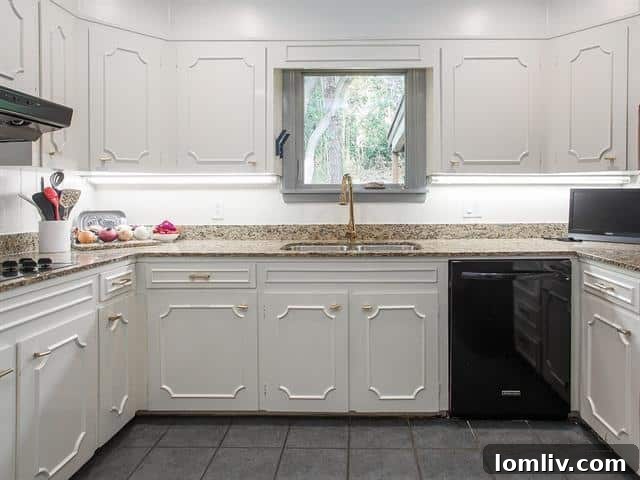 Spacious, open-concept kitchen with island and dining area in a renovated Fort Worth home