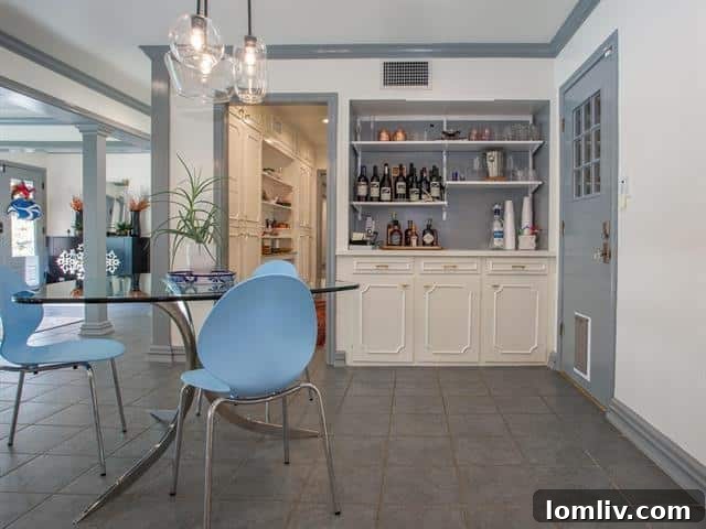 Cozy breakfast nook with bar seating, a bright spot in this Fort Worth kitchen