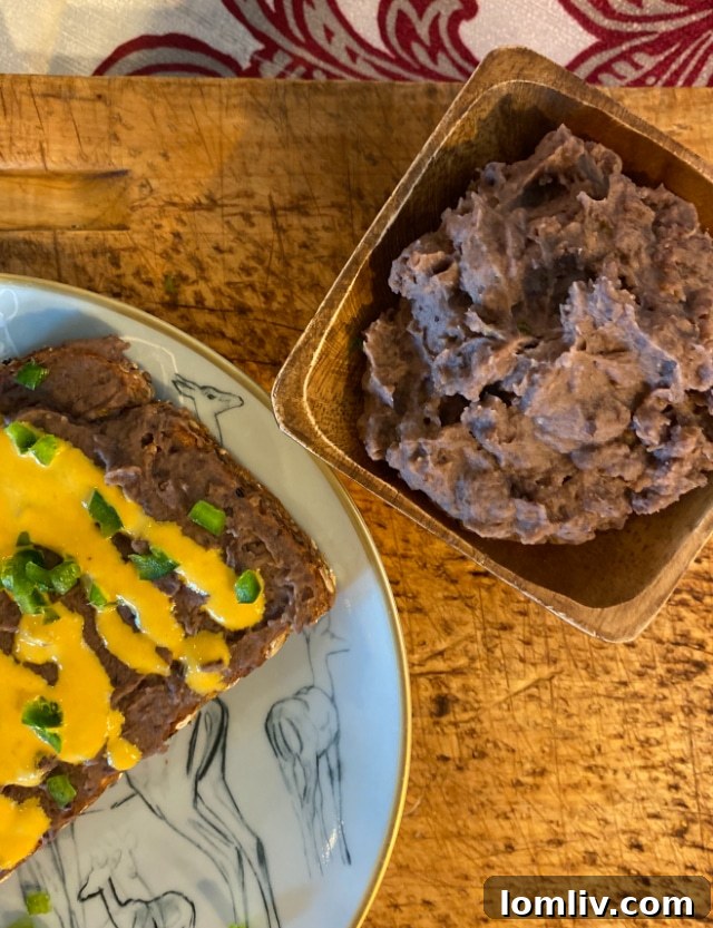 Holiday table setting with black beans, queso, and red wine
