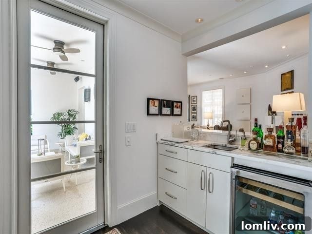 2020's Most Jaw-Dropping Mediterranean Mansion Still Turns Heads 16 4001-Turtle-Creek-wet-bar-to-patio