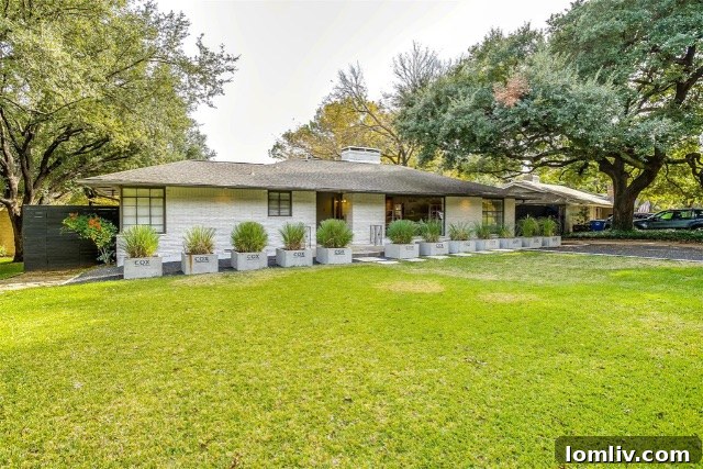 Midcentury Brilliance: A Home That Colors Your World with Joy 2 Front exterior view of a stunning mid-century modern home at 1338 Rainbow Drive in Oak Cliff, Dallas