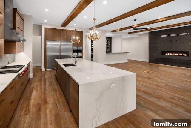 Modern kitchen with waterfall island and high-end appliances