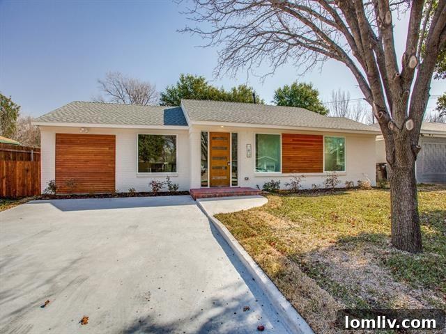 Renovated brick home exterior with manicured lawn in Fort Worth
