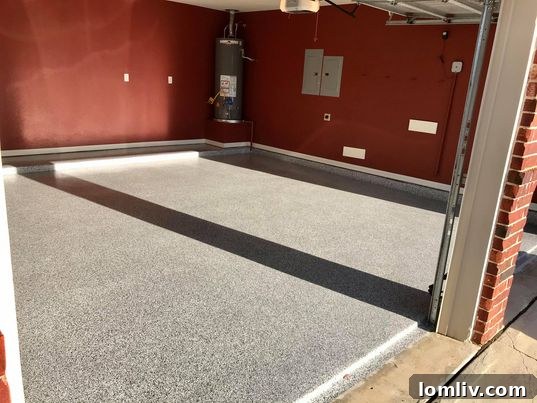 Professionally installed epoxy garage floor with decorative flakes.