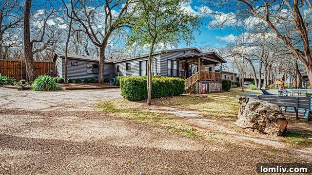 Stunning lakefront view of 9432 Heron Drive, a multi-unit luxury property in Lake Worth, Texas.