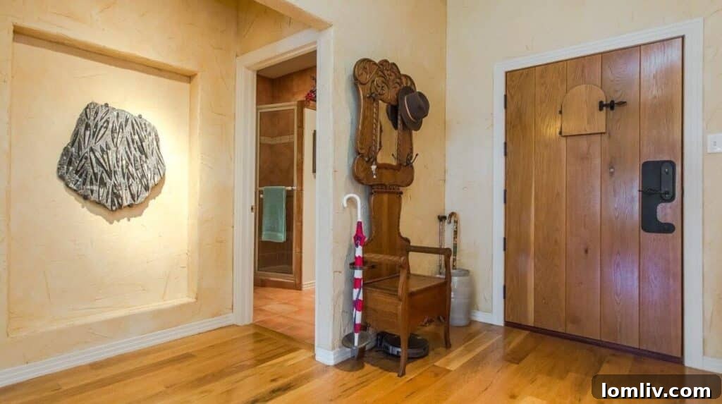 Pueblo-style interior featuring earth tones, viga beams, and stucco walls in a unique Fort Worth hangar home.