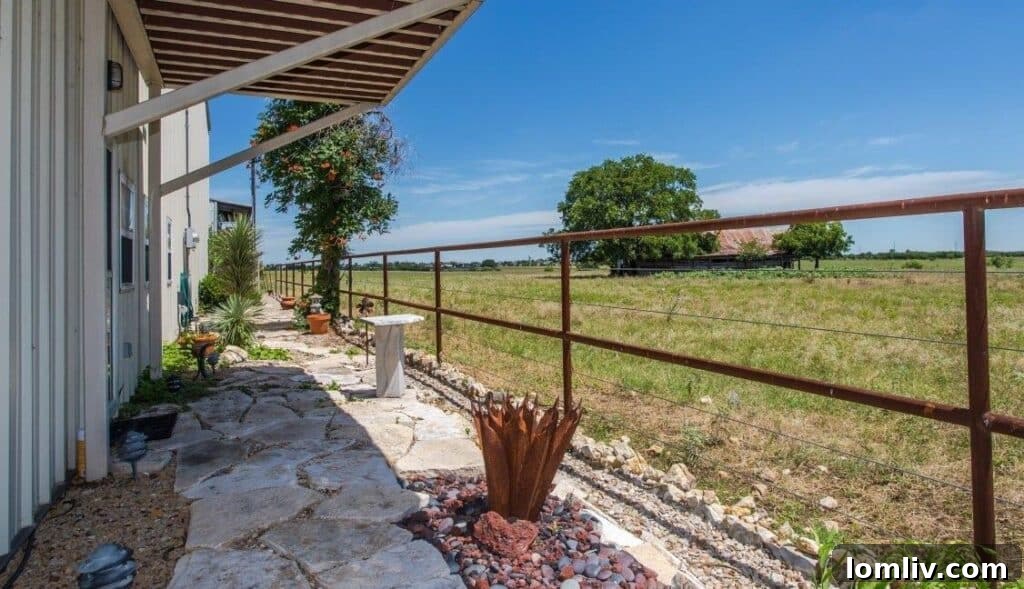 Experience the blend of aviation and Southwestern living in this remarkable hangar home, featuring an outdoor balcony.