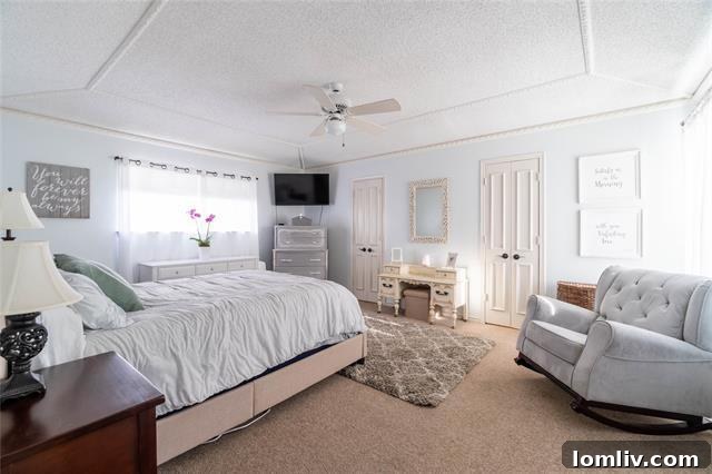 Lake Highlands Radiant Renewal 7 Tranquil primary suite with double walk-in closets and an en-suite bathroom with a garden tub.