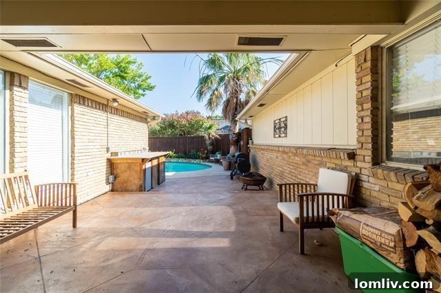 Lake Highlands Radiant Renewal 8 Exterior of Lake Highlands home showing a breezeway leading to the private pool and patio area.