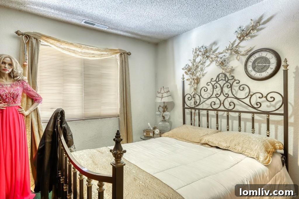 Mannequin sitting on an unmade bed in a bedroom, presenting an odd and perhaps critical image