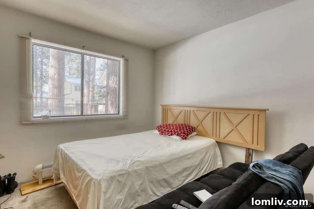 A bed with a large, elaborate headboard and a significantly narrower mattress, creating an odd visual
