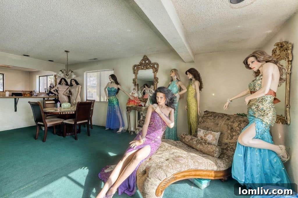 A mannequin sitting on a sofa in a living room, adding an unusual element to the home staging